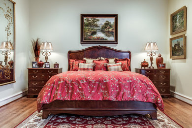 Example of a large classic master dark wood floor and brown floor bedroom design in Dallas with green walls and no fireplace