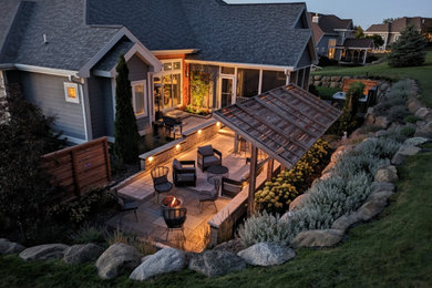 Inspiration for a mid-sized contemporary full sun backyard landscaping in Milwaukee.