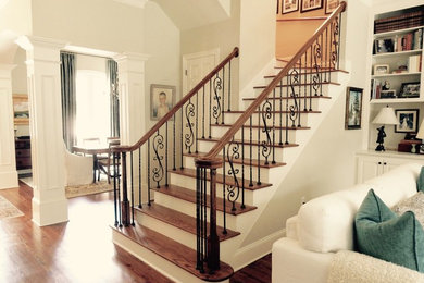 Inspiration for a mid-sized traditional wood l-shaped staircase in Other with painted wood risers and wood railing.