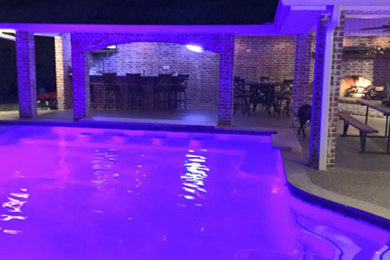 Pool - mid-sized backyard pool idea in Atlanta