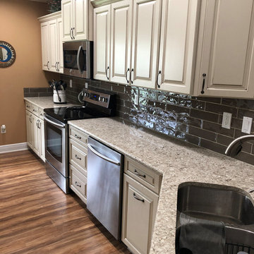 From standard builder's to beautifully cabinets, tops and splash!