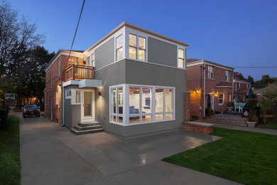 Mid-sized transitional green two-story mixed siding exterior home idea in Chicago