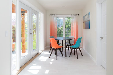 Eat-in kitchen - mid-sized contemporary ceramic tile eat-in kitchen idea in Vancouver with no island