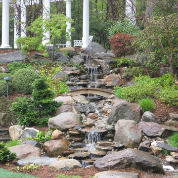 Rock waterfall and landscaping on a slope