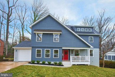 Huge transitional blue three-story vinyl house exterior idea in DC Metro