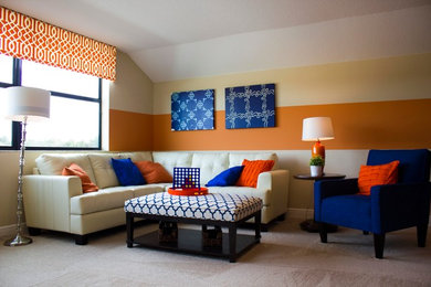Inspiration for a living room remodel in Tampa with orange walls