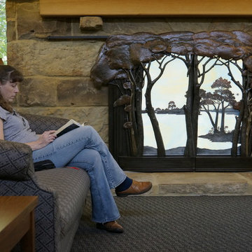 Library collaborative, back lit, sliding panels fireplace screen