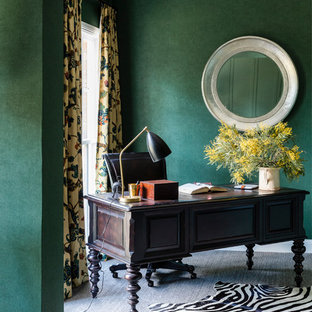 Photo of a large transitional study room in Sydney with green walls, carpet, a freestanding desk and grey floor.