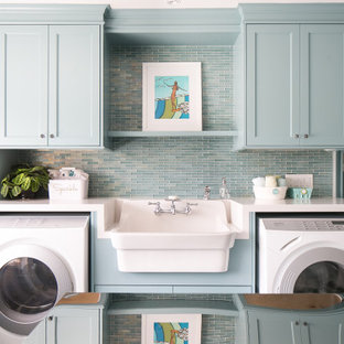 Design ideas for a beach style galley separated utility room in Orange County with an utility sink, shaker cabinets, turquoise cabinets, a side by side washer and dryer and white worktops.