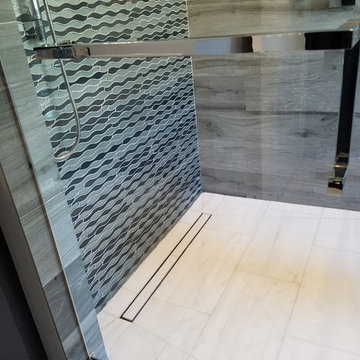 Master Bathroom Full Remodel Featuring Marble Floors and Countertops