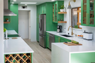 Example of a mid-sized minimalist galley eat-in kitchen design in Albuquerque with an undermount sink, shaker cabinets, green cabinets, quartzite countertops, a peninsula and white countertops