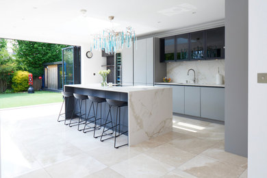 Eclectic sculpted lighting with a sleek shades of grey contemporary kitchen