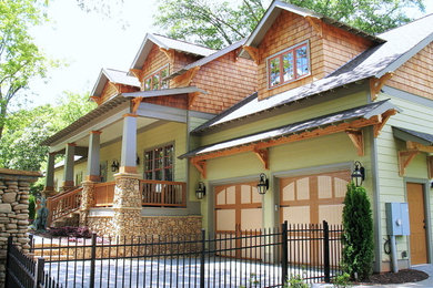Mid-sized craftsman green two-story mixed siding gable roof idea in Atlanta