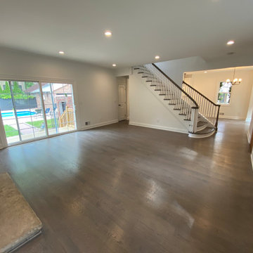 Open Living Room with Curved Staircase