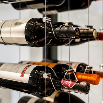 Glass encased Wine Cellar featuring CABLE WINE SYSTEMS®