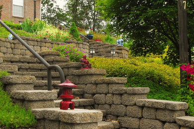 Inspiration for a mid-sized asian full sun front yard concrete paver formal garden in Other.