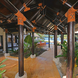 Example of an island style home design design in Other