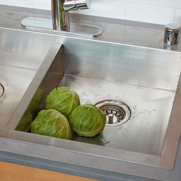 The kitchen sink is shallow enough to accommodate someone using a chair.