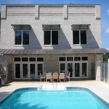 Contemporary Brick & Metal Awning Residence w/ Pool | Pontotoc, MS