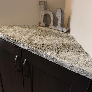 DuraSupreme Peppercorn Kitchen With Cambria Tops and Black Stainless Appliances