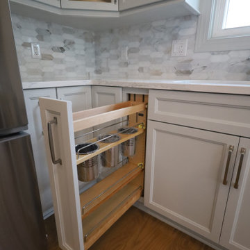 Sleek & Sophisticated: Gray Kitchen Remodel with Quartz Countertops, Marble Back