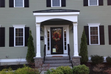 Example of a classic gray exterior home design in Boston