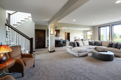 Design ideas for a large transitional open concept family room in Minneapolis with a home bar, grey walls, carpet and grey floor.
