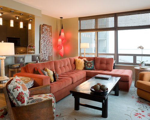 Rust-colored couch with eclectic accents