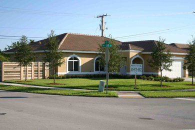 Example of an island style exterior home design in Miami
