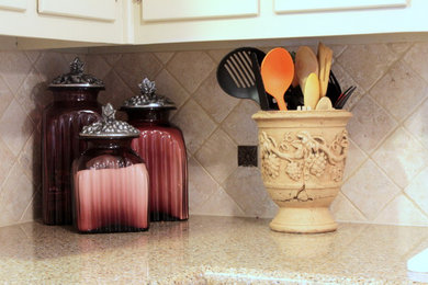 Example of a small classic l-shaped ceramic tile eat-in kitchen design in Austin with beige backsplash, white appliances and no island