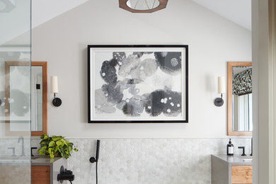 Design ideas for a mid-sized transitional master bathroom in Boston with a freestanding tub, white tile, white walls, an undermount sink, brown floor, a corner shower, marble, ceramic floors, granite benchtops, a hinged shower door, flat-panel cabinets, medium wood cabinets and grey benchtops.
