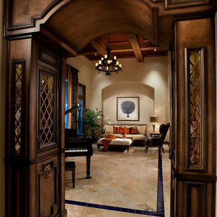 This is an example of a large mediterranean formal enclosed living room in Phoenix with beige walls and marble flooring.
