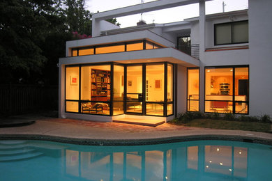 Inspiration for a mid-sized modern backyard kidney-shaped and stone natural pool remodel in DC Metro