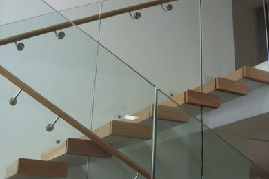 yoxall floating stairs with glass wall