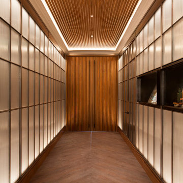 Cypress Lounge Entrance with Polished Steel and Reeded Glass