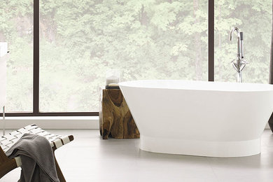Freestanding bathtub - mid-sized master white tile marble floor freestanding bathtub idea in Ottawa with a wall-mount sink and dark wood cabinets