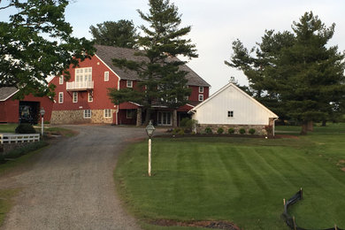 Example of a farmhouse exterior home design in Philadelphia