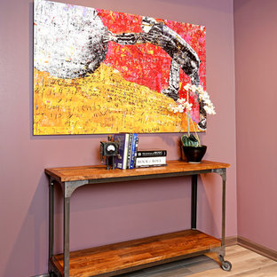 This is an example of a small eclectic vestibule in Chicago with purple walls and porcelain floors.