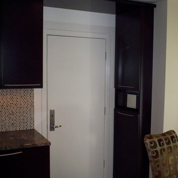 Flyover shelf joins cabinets both sides of door