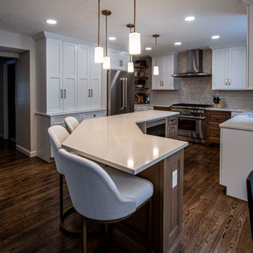 Two Tone Kitchen with Floating Shelves and Island Seating and Updated Fireplace