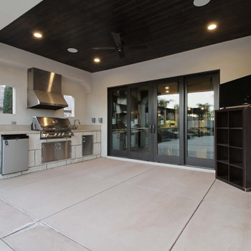 Spanish Transitional Outdoor Kitchen with Stained Wood Ceiling