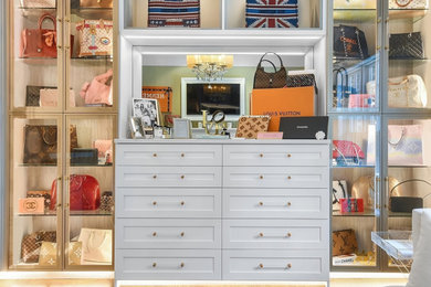 Inspiration for a contemporary dressing room for women with open cabinets.