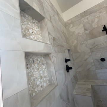Curd-less walk-in shower; heated floors in bathroom + shower+bench LED