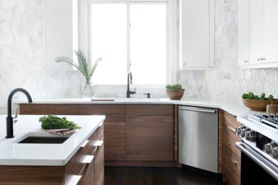 Inspiration for a large contemporary u-shaped dark wood floor, brown floor and vaulted ceiling enclosed kitchen remodel in Los Angeles with an undermount sink, flat-panel cabinets, white cabinets, quartz countertops, gray backsplash, porcelain backsplash, stainless steel appliances, an island and white countertops