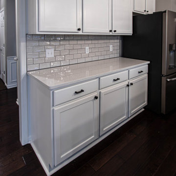 Two Tone Kitchen: White Cabinetry with Custom Knotty Alder Island and Faux Beam
