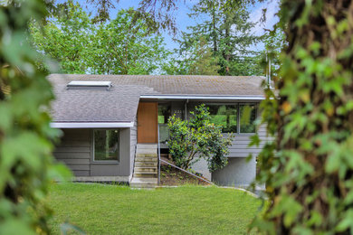 Example of a cottage exterior home design in Vancouver