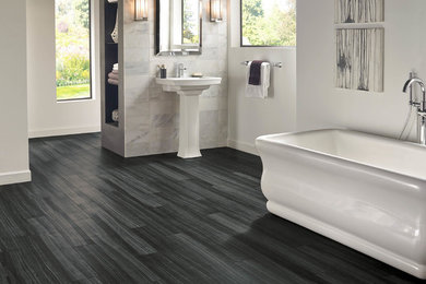 Freestanding bathtub - mid-sized contemporary master gray tile and ceramic tile vinyl floor freestanding bathtub idea in Phoenix with gray walls and a pedestal sink