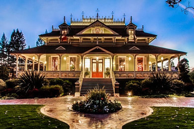 Example of a classic green two-story vinyl house exterior design in San Francisco
