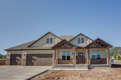 Elegant beige stucco exterior home photo in Salt Lake City