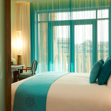 Elegant Bedroom with Turquoise Accents and Balcony View